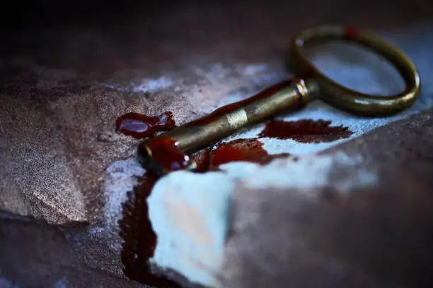 Ancient key with blood drops