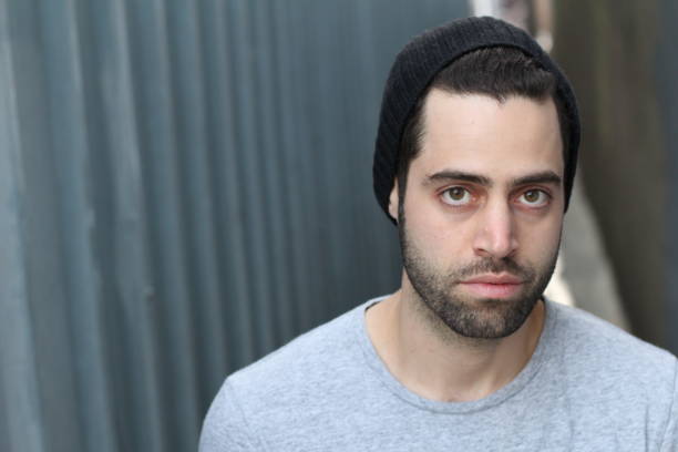 istock Young man against empty urban alley way 692962288