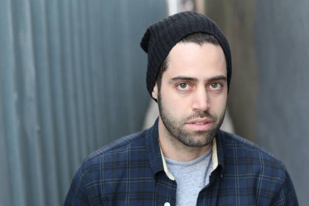 istock Young man against empty urban alley way 692962466