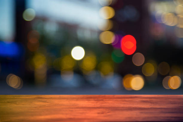 downtown city night lights with blank bar counter, table. - street furniture traffic lighting equipment urban scene imagens e fotografias de stock