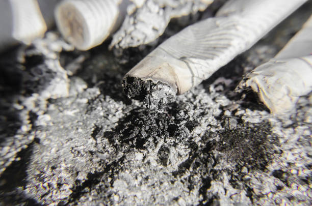 istock Close up on many cigarette butts and ashes 692965116