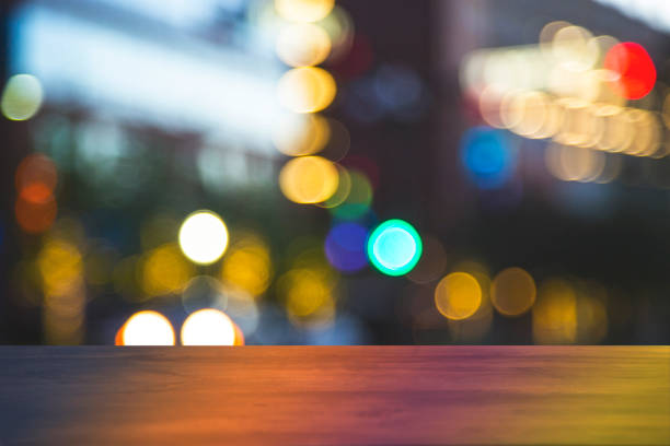 downtown city night lights with blank bar counter, table. - street furniture traffic lighting equipment urban scene imagens e fotografias de stock