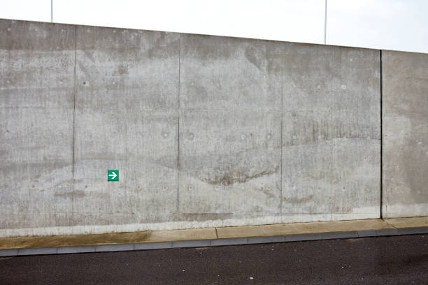 istock green arrow on concrete wall 692971116