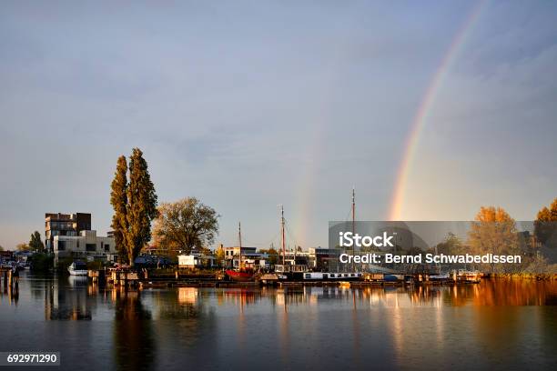 Rainbow Over Channel In Amsterdam Netherlands P Stock Photo - Download Image Now - Amsterdam, Atmosphere, Capital Cities