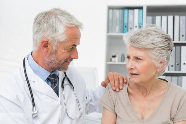 istock Female senior patient visiting a doctor 692972584