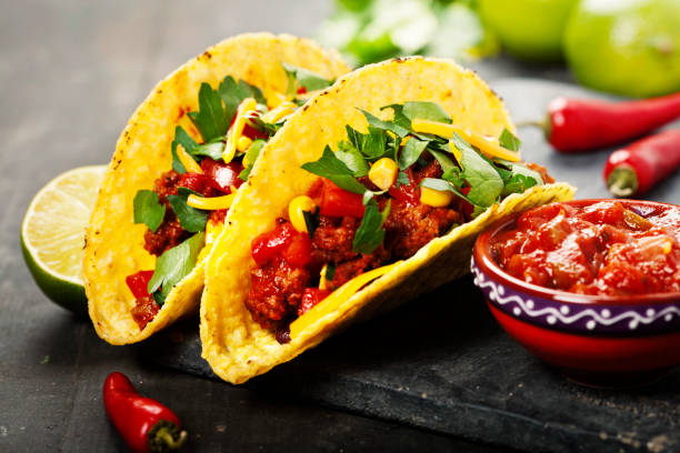 istock Mexican tacos with meat, beans and salsa 692972634