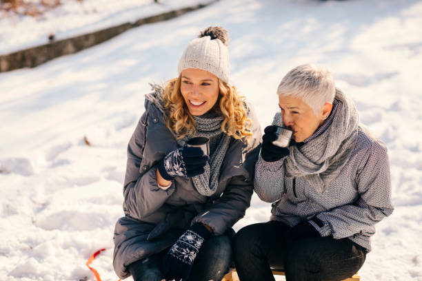 istock Women Drinking Tea Outdoors At Winter 692972712