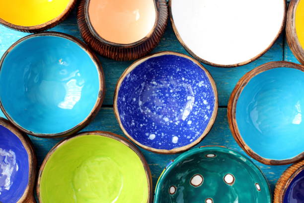 istock Many different bright multicolored ceramic bowls and cups handcrafted. Background texture 692973194