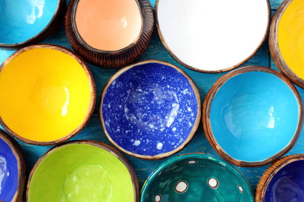 istock Many different bright multicolored ceramic bowls and cups handcrafted. Background texture 692975634