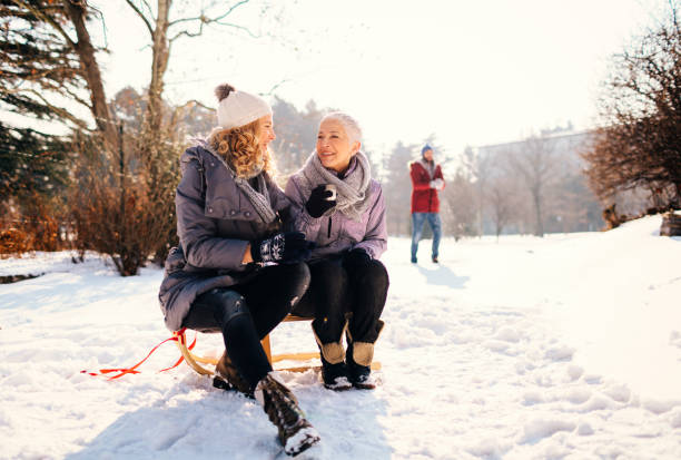 istock Two Generation Family Having Fun Outdoors At Winter 692976224
