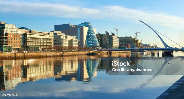 Modern Buildings On Liffey River In Dublin And Harp Bridge Stock Photo - Download Image Now