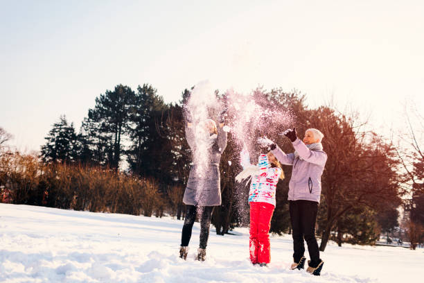 istock Two generation family Having Fun Outdoors At Winter Time. 692982598