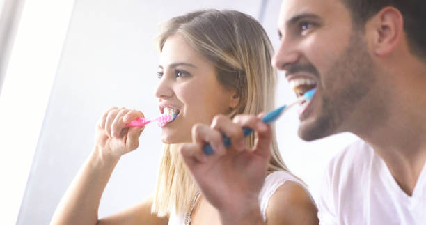 istock Couple brushing teeth in the morning. 692985574