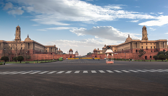 NEW DELHI, INDIA, MARCH 17, 2017: An early morning view of Rashtrapati Bhavan and adjoining Rajpath road Delhi, India. A classic colonial styled architectural building which houses the President of India.