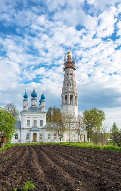 The Church of the Holy Archangel Michael and the bodiless hosts in the village of Mikhailovskoye, Ivanovo oblast , Russia. Church of the Holy Archangel Michael and the bodiless hosts in the village of Mikhailovskoye. In the foreground is a plowed field. Ivanovo oblast, Russia. ivanovo oblast photos stock pictures, royalty-free photos & images