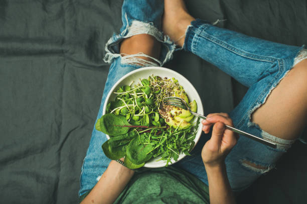 istock Vegetarian breakfast bowl with spinach, arugula, avocado, seeds and sprouts 692990626