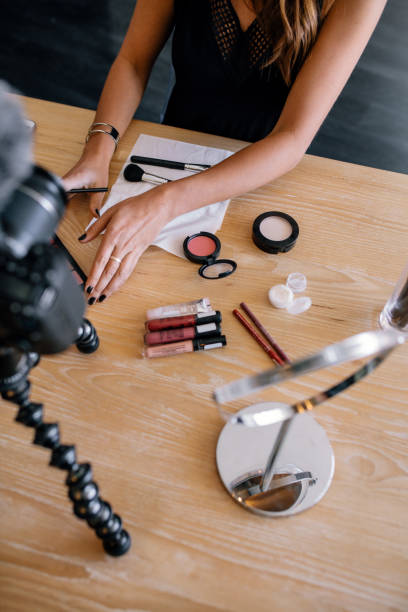 istock Young female vlogger recording a make-up video for her vlog. 692996234
