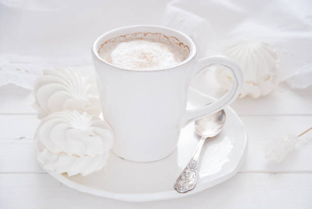istock Coffee and marshmallow on a white wooden background 693003676