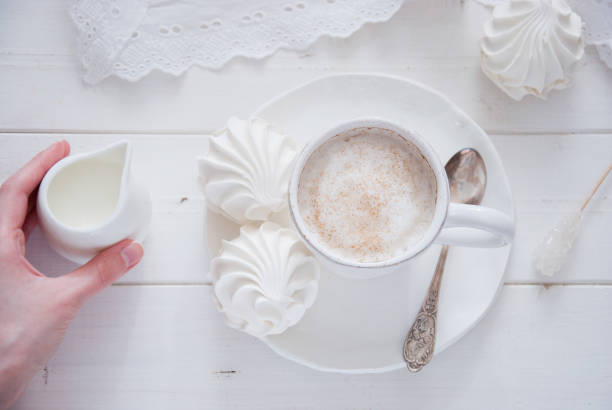 istock Coffee and marshmallow on a white wooden background 693003894