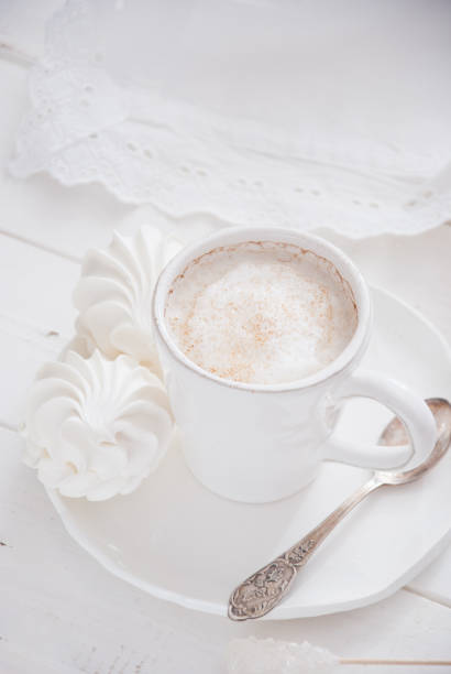 istock Coffee and marshmallow on a white wooden background 693004684