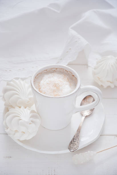 istock Coffee and marshmallow on a white wooden background 693006274