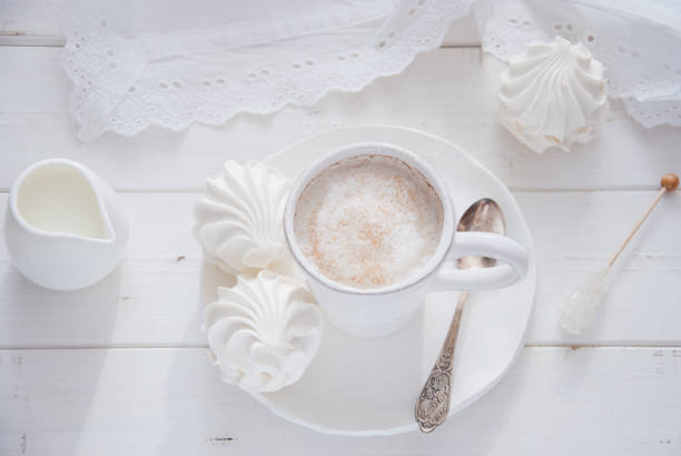 istock Coffee and marshmallow on a white wooden background 693006446