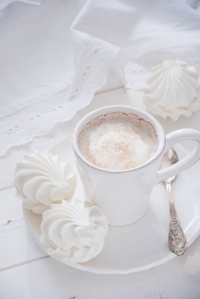 istock Coffee and marshmallow on a white wooden background 693007410