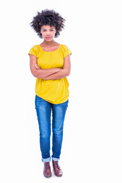 istock Serious pretty hipster with arms crossed looking at camera 693020358
