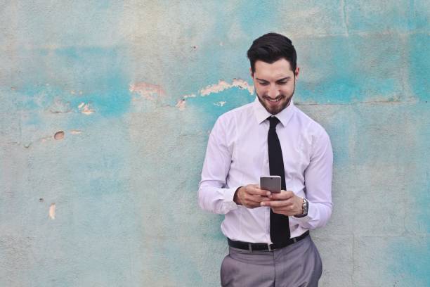 istock Businessman in front of a blue wall 693020380