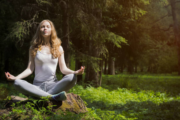 istock Girl doing yoga in nature. 693026672