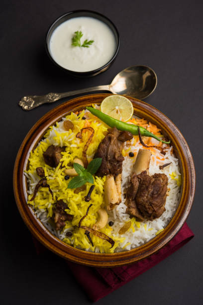 istock kashmiri Mutton Gosht Biryani / Lamb Biryani / Mutton Biryani served with Yogurt dip, selective focus 693027340