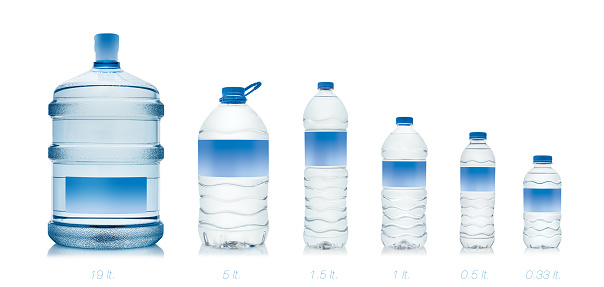 from 19 liter to 330 ml. drinking water bottles on white background