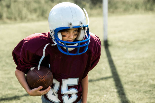 istock Little american football player 693030314