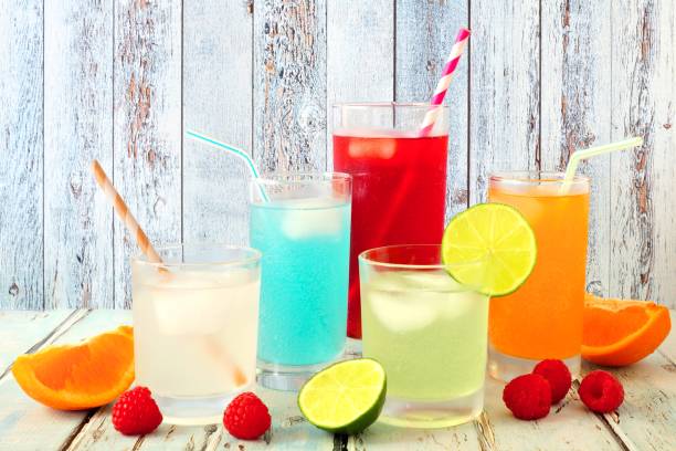 istock Cool colorful summer drinks against rustic wood 693030792