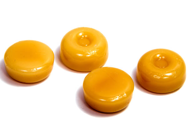 istock caramel candies on white background 693040798
