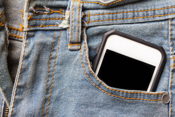istock jeans and mobile phone. Phone in your pocket jeans 693040996