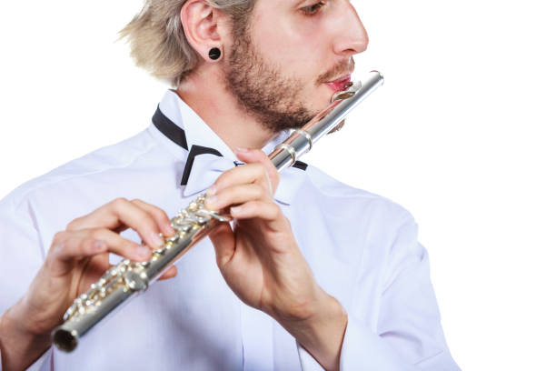 istock Male flutist playing his flute 693041358
