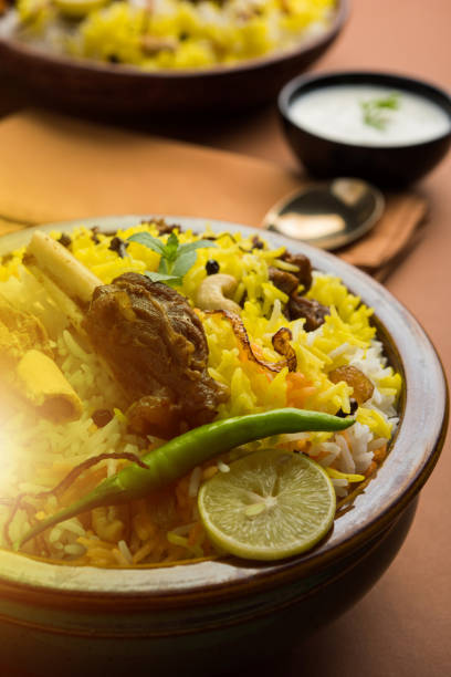 istock kashmiri Mutton Gosht Biryani / Lamb Biryani / Mutton Biryani served with Yogurt dip, selective focus 693041912