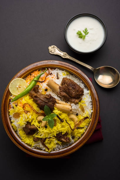istock kashmiri Mutton Gosht Biryani / Lamb Biryani / Mutton Biryani served with Yogurt dip, selective focus 693044832