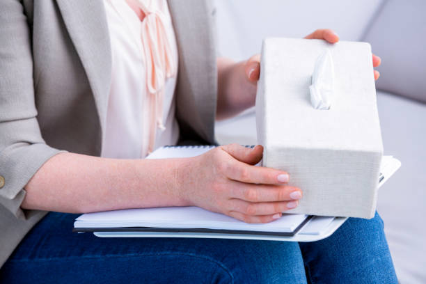 istock Businesswoman holding paper tissue box 693047464