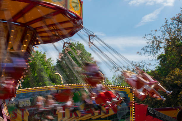 istock Swinging ride at a carnival with motion blur 693049726
