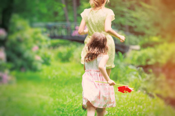 Mother run away from young girl Mother run away from young girl in the park. chrysobalanaceae stock pictures, royalty-free photos & images
