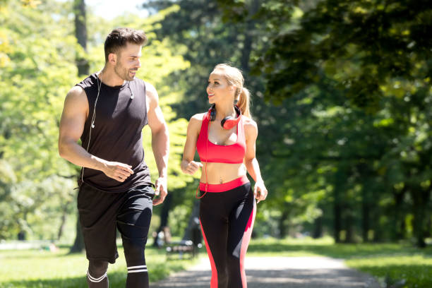 istock Caucasian couple running outdoor. 693064184