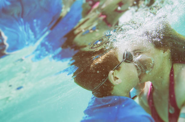 istock mother and son underwater in the ocean 693071002