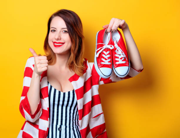 istock Woman with red gumshoes 693071576