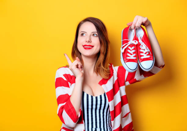 istock Woman with red gumshoes 693071596