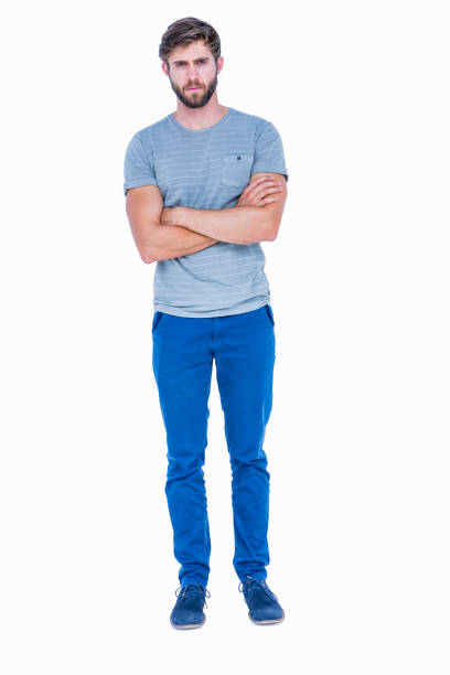 istock Unhappy handsome man looking at camera with arms crossed 693085440