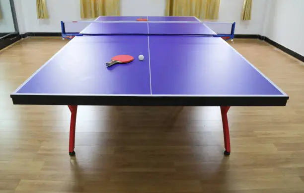 Photo of Ping pong table and ball