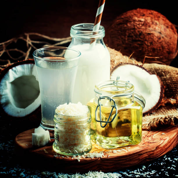 istock Coconut products set: milk, water, oil, shavings 693094304