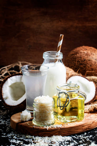 istock Coconut products set: milk, water, oil, shavings 693094528